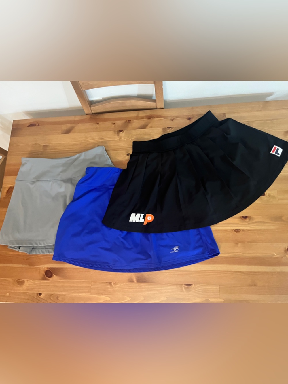 Small pickleball skirts, two FILA and one soothfeel